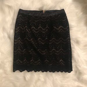 Guess black and gold mini skirt